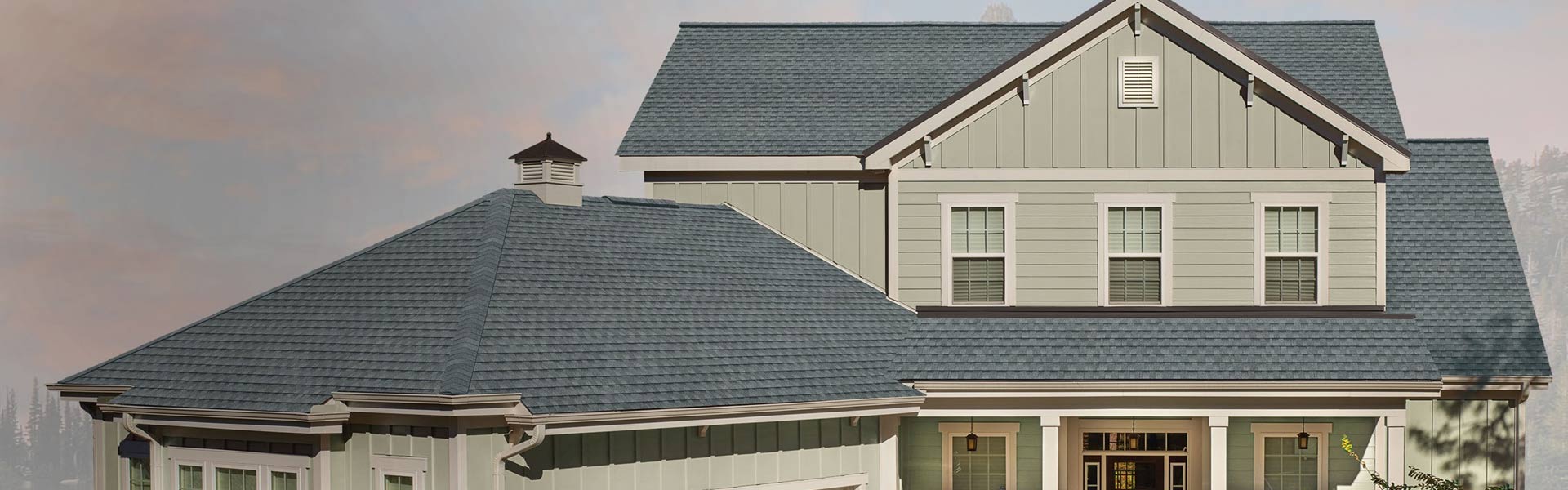 Home with a dark gray shingle roof